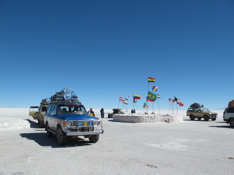 Toyotas and Tourists at the Salar\'s entrance.